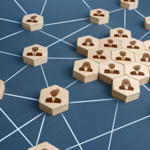Business Membership product image A group of wooden people connected to each other on a blue background.